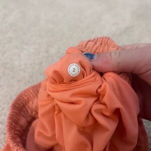 LULULEMON, size 2, 2.5 in, color- coral, low rise